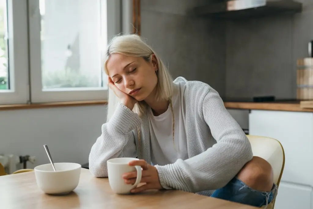 woman sleeping at table